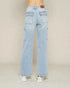 Light blue jeans worn by a person on a plain background