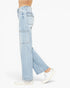 Light wash blue denim cargo-style jeans shown on a model from the waist down, paired with white sneakers against a clean white background.