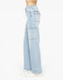 Light wash blue wide-leg jeans with large cargo pockets, shown on a model from the waist down wearing white sneakers against a plain white background.