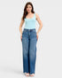 Woman wearing a light blue tank top and high-waisted blue jeans on a white background