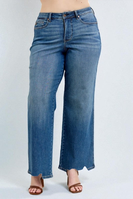 Blue jeans worn by a person on a white background