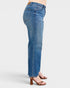 Blue jeans worn by a person on a white background