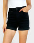 Person wearing black shorts on a white background