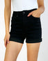 Person wearing black shorts on a white background