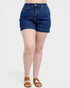 Person wearing blue denim shorts on a white background