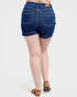 Person wearing blue denim shorts on a white background