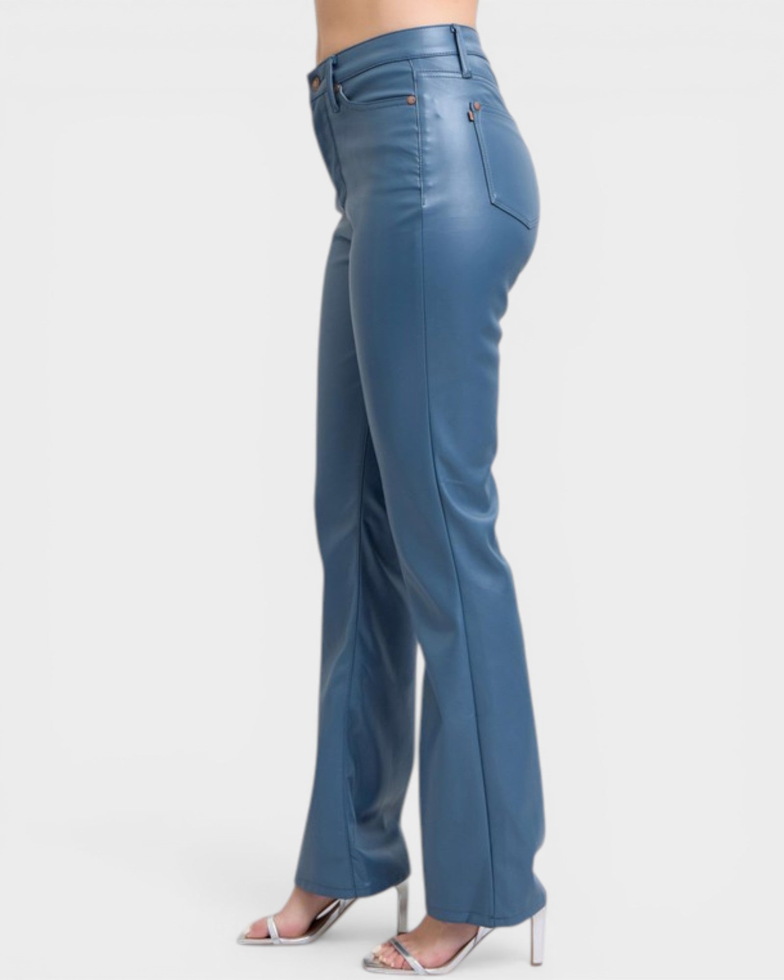 Blue pants worn by a person on a white background