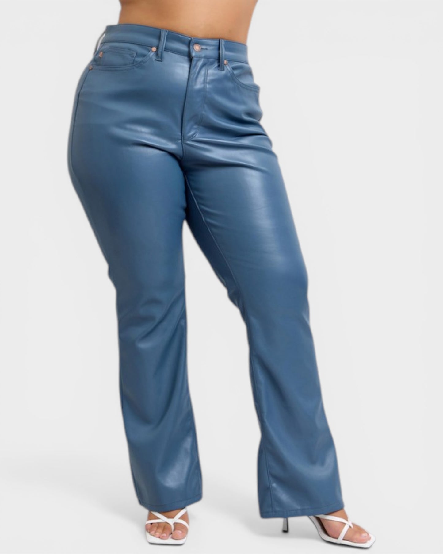 Blue leather pants worn by a person on a white background
