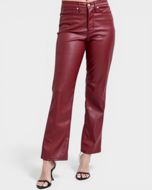 Maroon leather pants on a white background