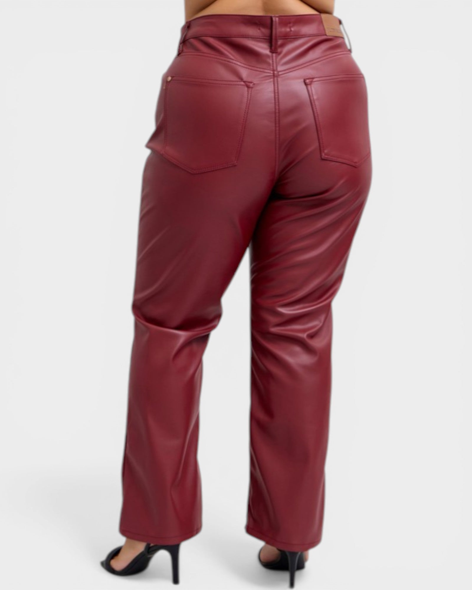 Maroon leather pants on a white background