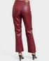 Maroon leather pants on a white background