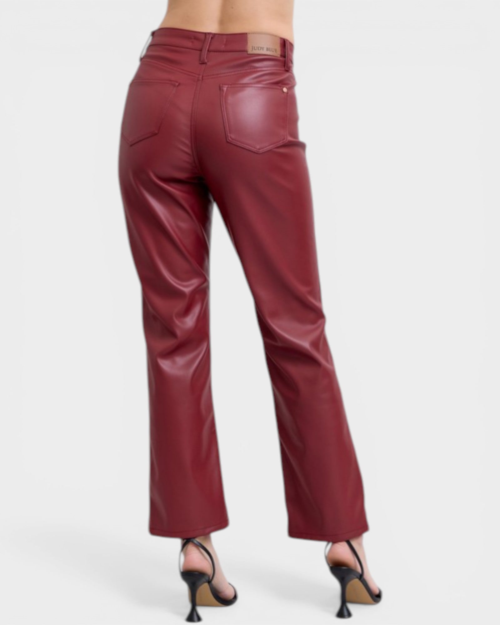 Maroon leather pants on a white background
