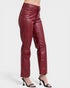 Maroon leather pants worn by a person on a white background