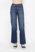 Blue jeans worn by a person on a white background