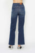 Blue jeans worn by a person on a white background