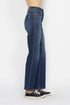Blue jeans worn by a person on a white background