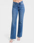 Blue jeans worn by a person on a white background