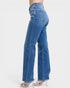 Blue jeans worn by a person on a white background