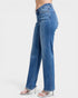 Blue jeans worn by a person on a white background