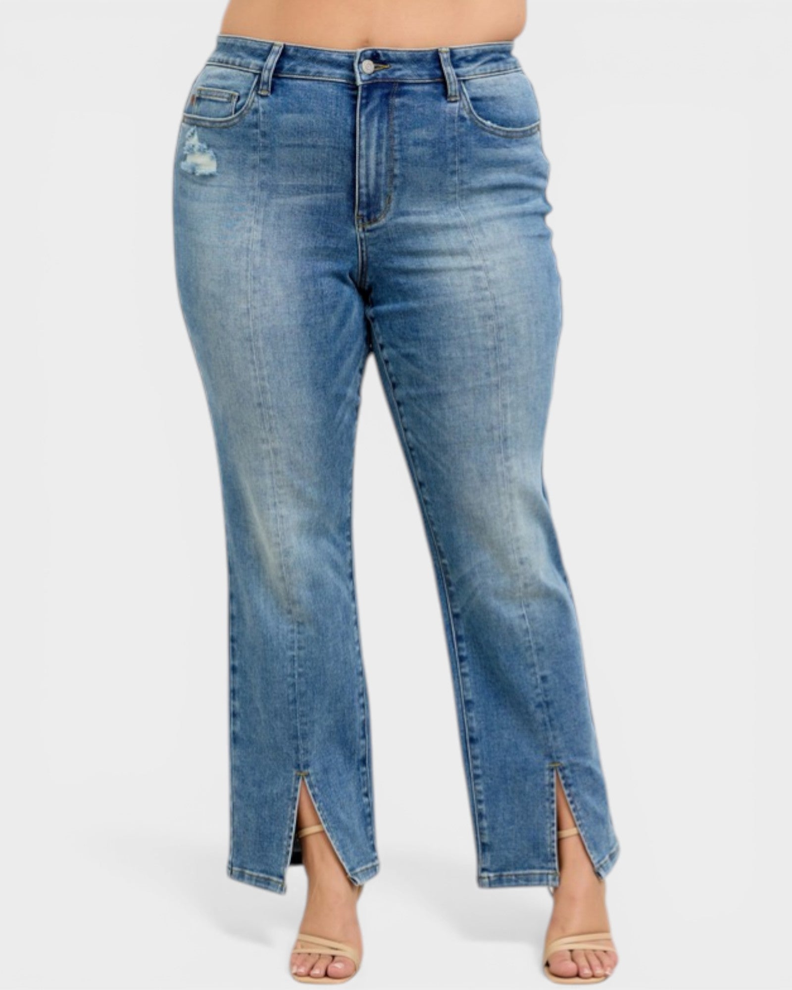 Blue jeans with a slit design on a white background