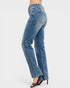 Blue jeans worn by a person on a white background