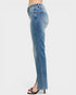 Blue jeans worn by a person on a white background