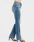 Blue jeans worn by a person on a white background