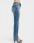 Blue jeans worn by a person on a white background