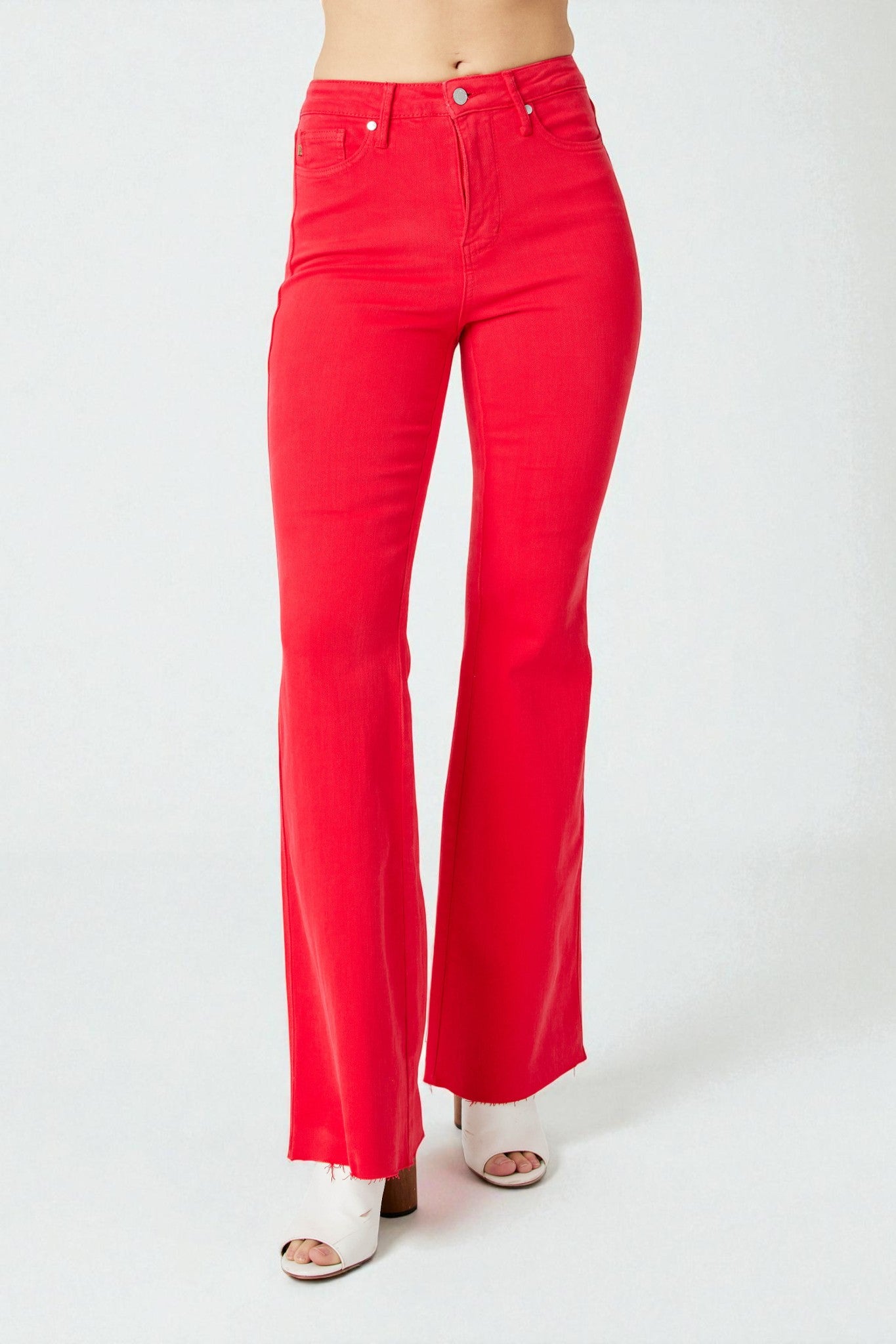 Red flared jeans on a white background
