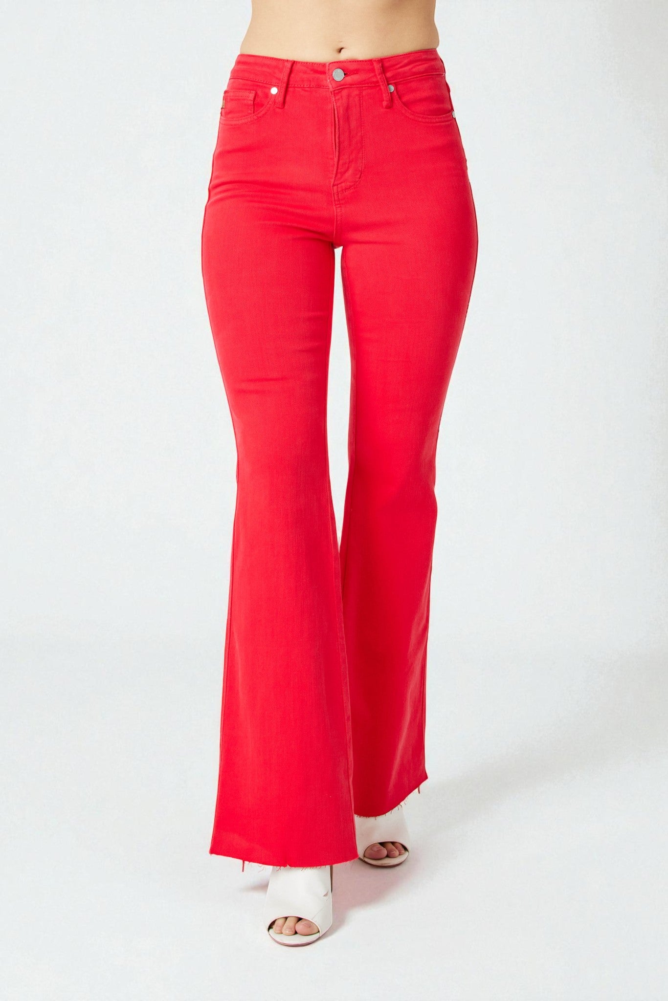 Red flared jeans on a white background