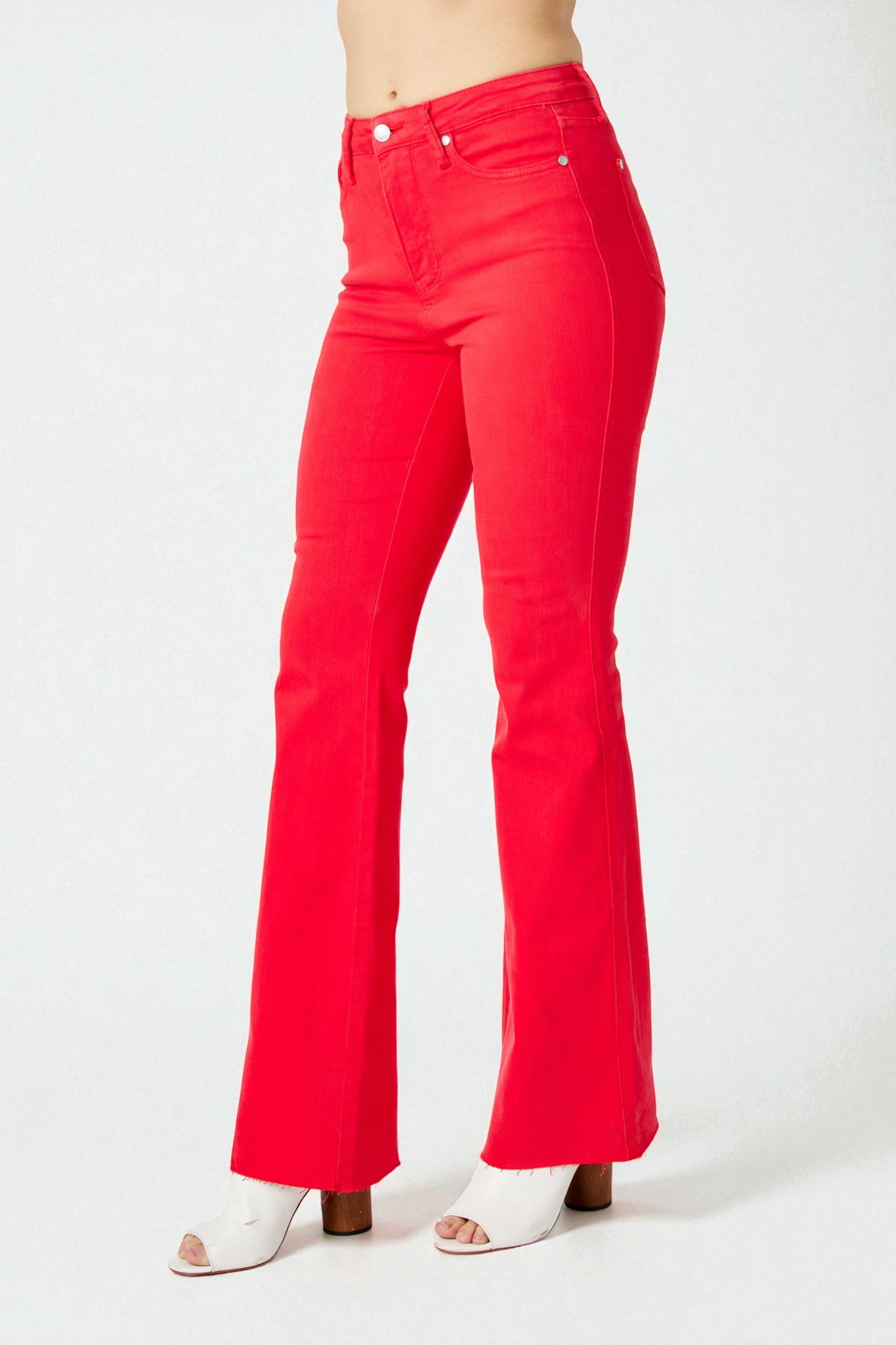 Red flared jeans on a white background