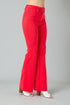 Red flared jeans on a gray background