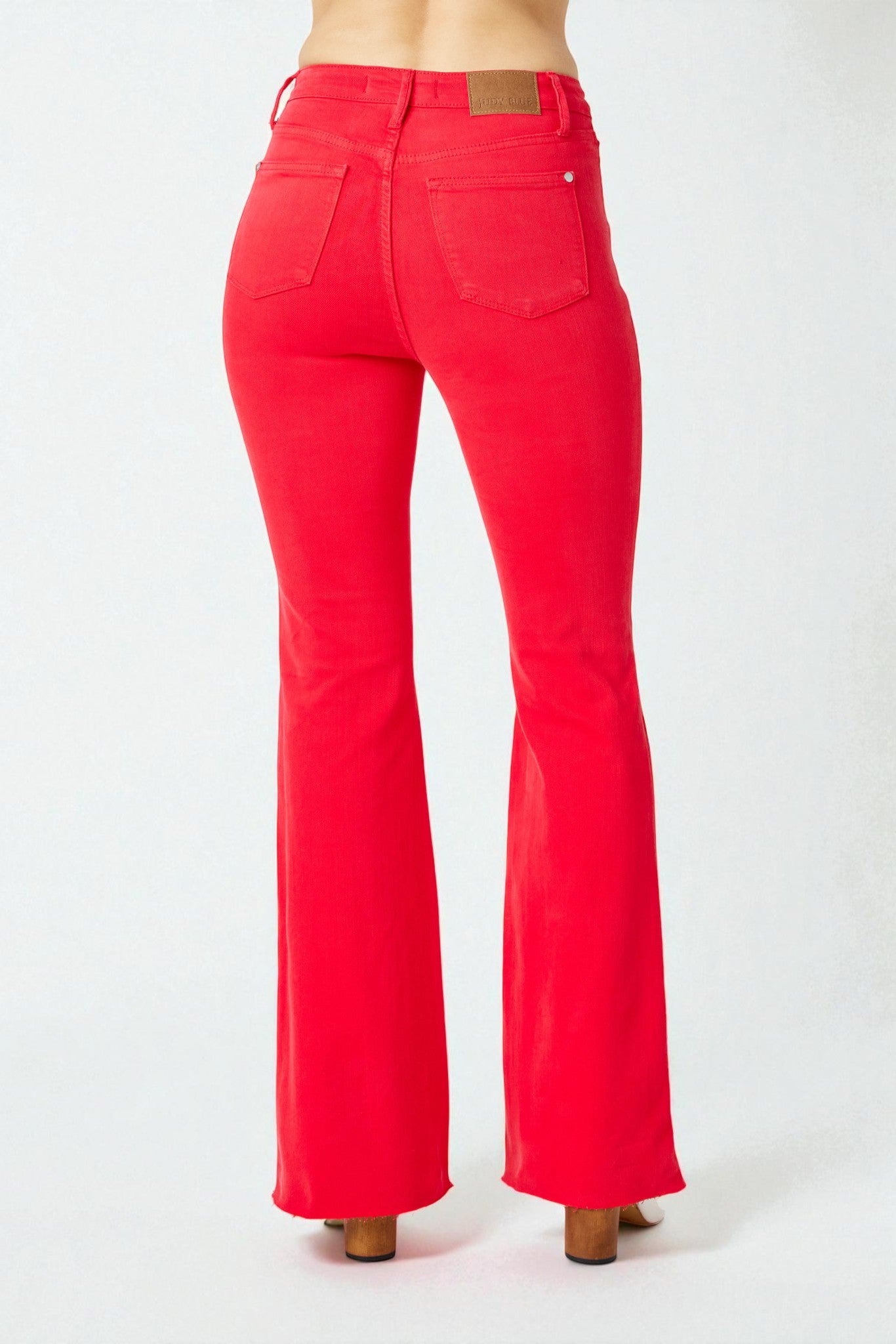 Red flared jeans on a white background