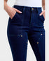 Navy blue jeans worn by a person on a white background