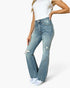 Jeans acampanados con lavado medio y control de abdomen