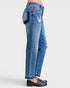 Blue jeans with patchwork design on a white background