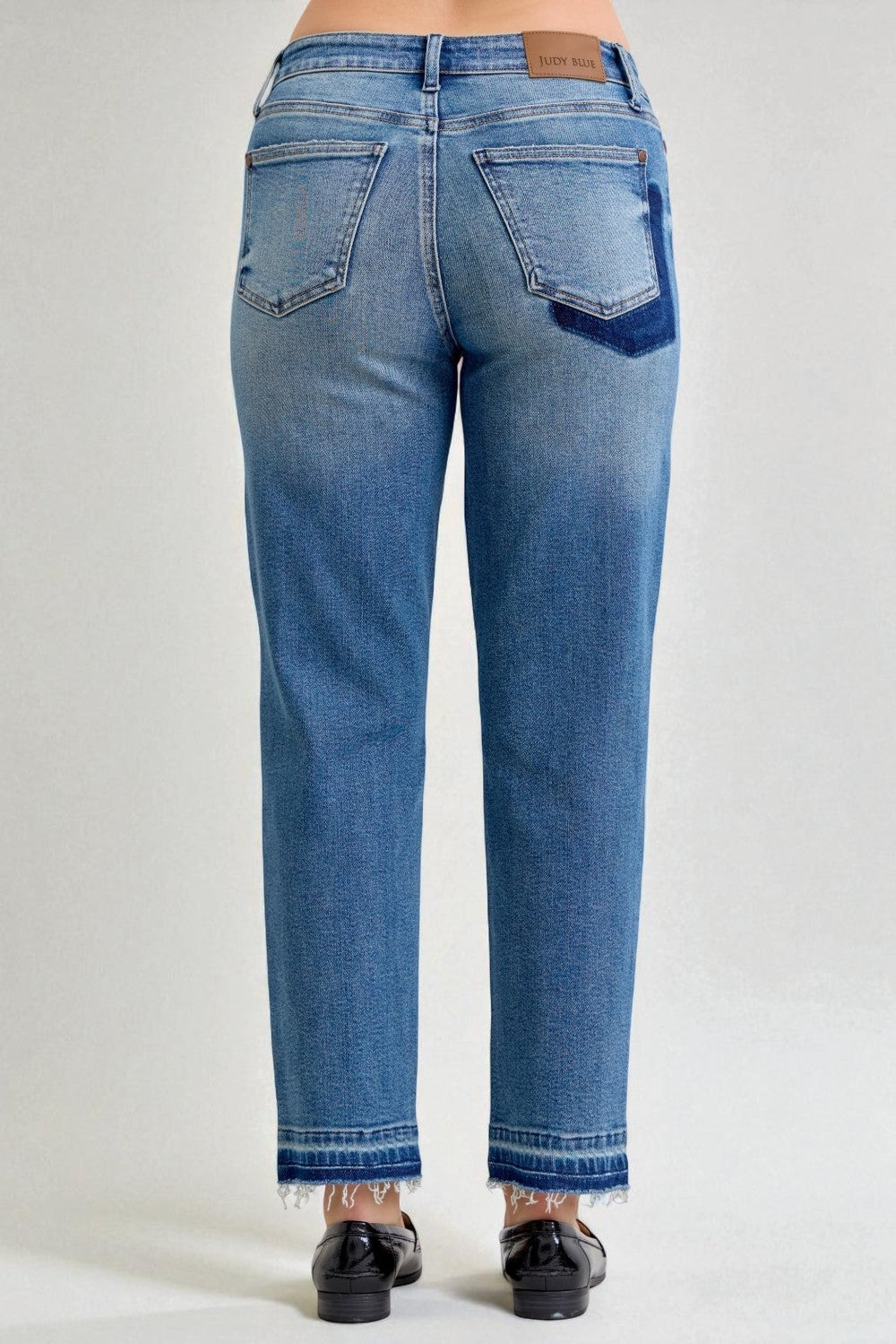 Blue jeans on a plain background