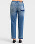 Blue jeans worn by a person on a white background