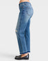 Blue jeans worn by a person on a white background