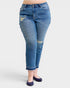 Blue jeans with distressed details on a white background