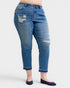 Blue jeans with distressing on a white background