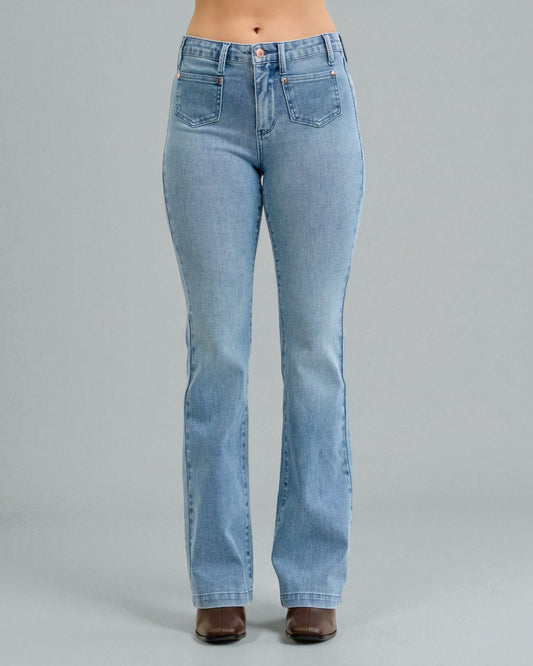 Light blue jeans worn by a person on a gray background
