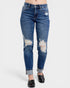 Distressed blue jeans on a white background