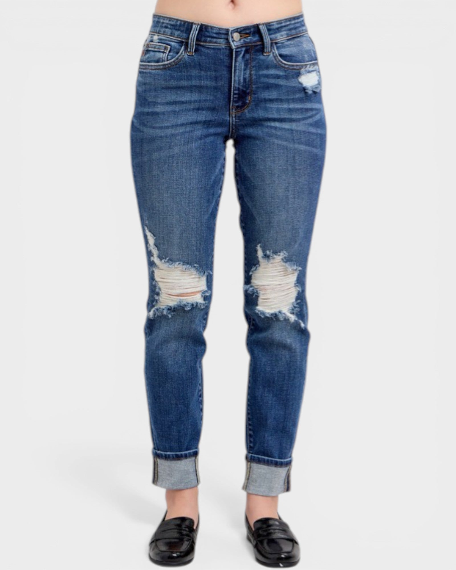 Blue distressed jeans on a white background