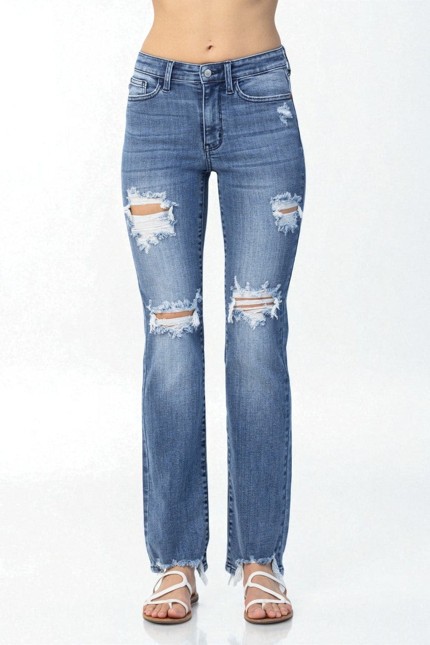 Blue distressed jeans on a white background