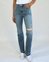 Person wearing blue jeans with a white background
