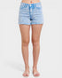 Light blue denim shorts worn by a person on a white background