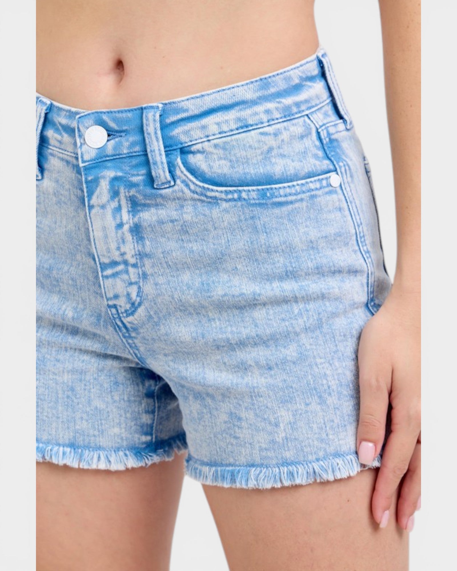 Light blue denim shorts worn by a person on a white background
