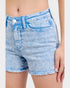 Light blue denim shorts worn by a person on a white background