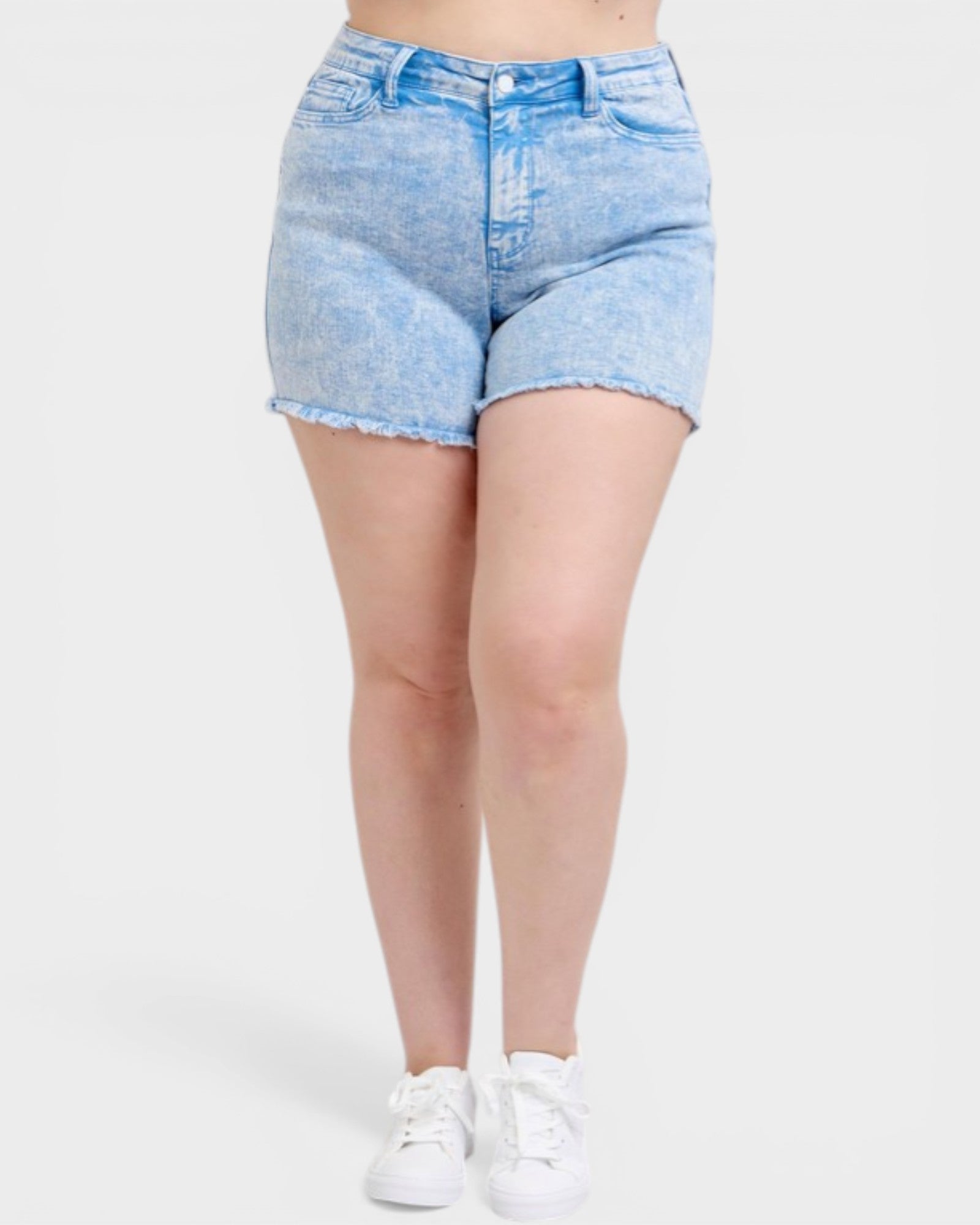 Light blue denim shorts worn by a person on a white background